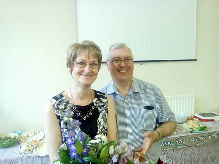Veronica and Pastor Bob with presents